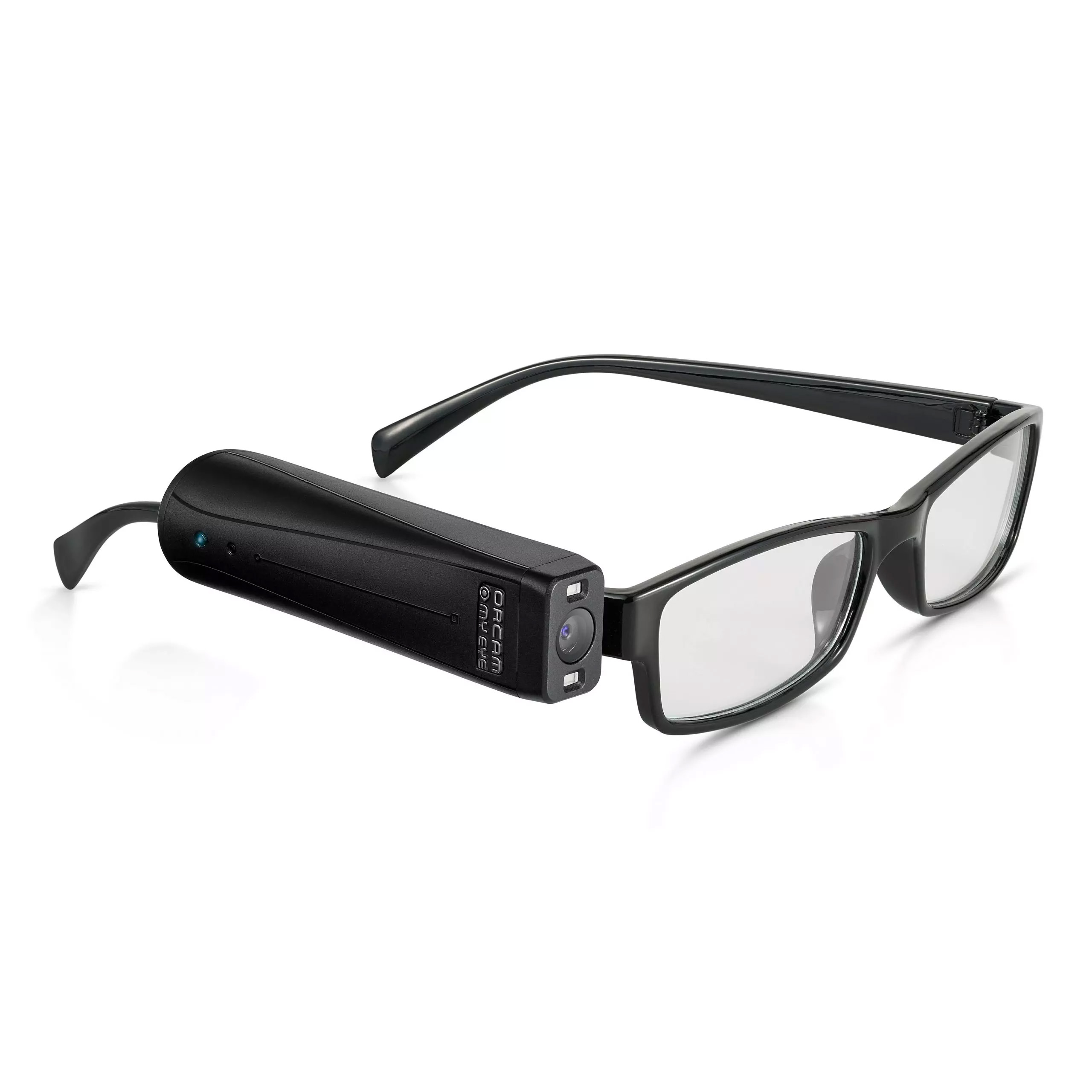 Fotografía de un dispositivo OrCam MyEye 2 de plástico negro con cámara frontal e iluminación LED, montado en la patilla lateral de unos lentes de armazón negro.